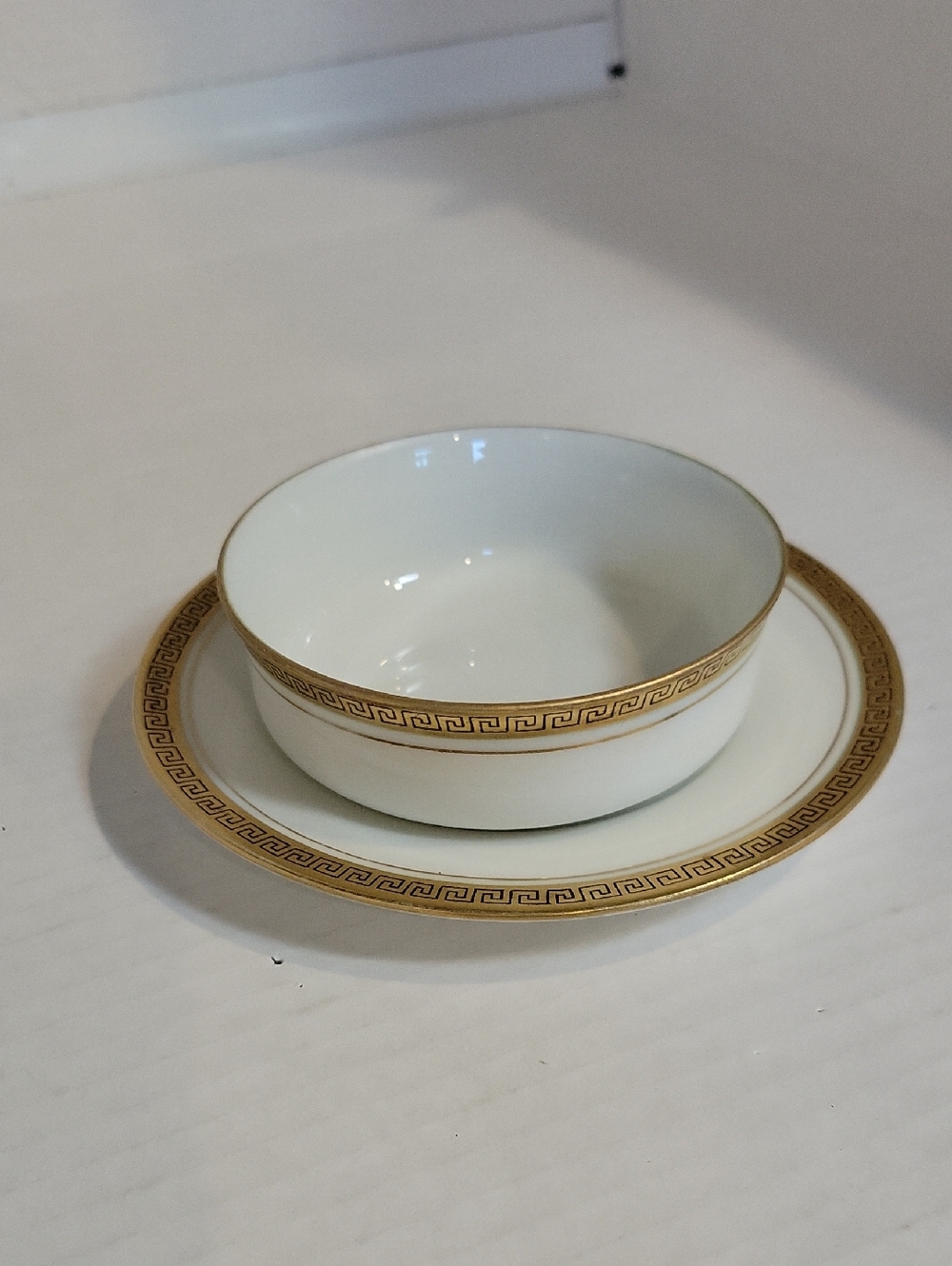 White Porcelain Bowl and Plate Set with Gold Greek Key Border